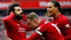 Liverpool's Mohamed Salah celebrates scoring their second goal with Jordan Henderson and Virgil van Dijk.(REUTERS) Liverpool's Mohamed Salah celebrates scoring their second goal with Jordan Henderson and Virgil van Dijk.(REUTERS)