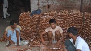 Labourers at work at a glass and bangle unit in Firozabad. The city is known for its bangles and glass indsutry.(HT Photo) Labourers at work at a glass and bangle unit in Firozabad. The city is known for its bangles and glass indsutry.(HT Photo)