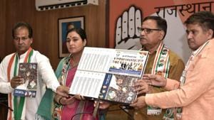 (2nd from R.)Congress MLA Mahesh Joshi along with other officials on Sunday released a folder focussing on 15 main points in the manifesto and photos of all 25 Congress candidates for Rajasthan Lok Sabha seats.(HT Photo)