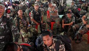 Paramilitary forces being assemble at the polling distribution centre to move on the eve of Lok Sabha elections 2019, in Chamkaghat 50 km from Agartala on Monday.(ANI)