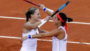 France's Kristina Mladenovic and Caroline Garcia celebrate after winning their doubles match against Romania's Simona Halep and Monica Niculescu(REUTERS) France's Kristina Mladenovic and Caroline Garcia celebrate after winning their doubles match against Romania's Simona Halep and Monica Niculescu(REUTERS)