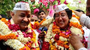 Aam Aadmi Party (AAP) candidate from East Delhi, Atishi with Delhi Deputy Chief Minister Manish Sisodia shows victory sign on her way to file nomination form for the upcoming Lok Sabha elections 2019 in New Delhi on Monday.(ANI)