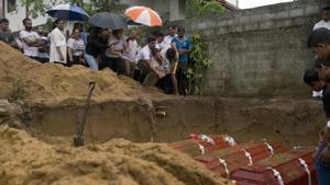 Relatives bury three members of the same family, all died at Easter Sunday bomb blast at St. Sebastian Church in Negombo, Sri Lanka, Monday(AP) Relatives bury three members of the same family, all died at Easter Sunday bomb blast at St. Sebastian Church in Negombo, Sri Lanka, Monday(AP)
