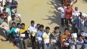 Voters wait in long queues to cast their votes at a polling station(PTI) Voters wait in long queues to cast their votes at a polling station(PTI)