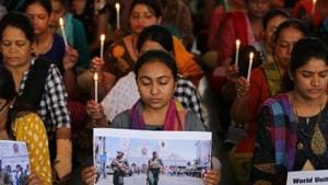 Teachers hold candles as they pray for the victims of Sri Lanka's serial bomb blasts.(REUTERS) Teachers hold candles as they pray for the victims of Sri Lanka's serial bomb blasts.(REUTERS)