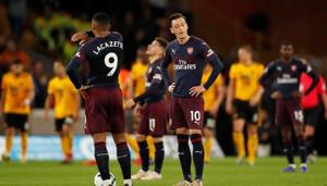 Arsenal's Mesut Ozil and Alexandre Lacazette react after Wolverhampton Wanderers' Diogo Jota scored their third goal(Action Images via Reuters) Arsenal's Mesut Ozil and Alexandre Lacazette react after Wolverhampton Wanderers' Diogo Jota scored their third goal(Action Images via Reuters)