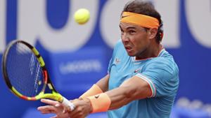 Rafael Nadal of Spain eyes the ball before returning to David Ferrer of Spain.(AP) Rafael Nadal of Spain eyes the ball before returning to David Ferrer of Spain.(AP)