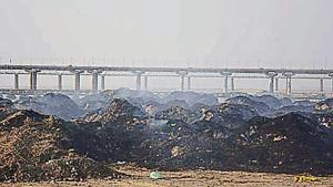 Solid waste being burnt at Parade Ground near Sangam in Prayagraj.(HT Photo)