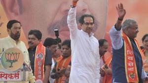 (From left) BJP Pune candidate, Girish Bapat, Shiv Sena chief Uddhav Thackeray and Shirur Lok Sabha candidate Shivajirao Adhalrao Patil at a public rally on Thursday.(HT/PHOTO)