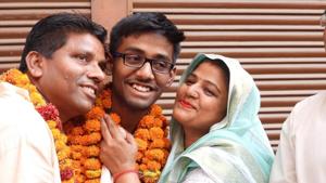 Gautam Raghuvanshi of Onkareshwar SVN Inter College, Jawhahar Nagar, Kanpur, tops UP Board high school exam, the results for which were declared on Friday. (Gautam with his parents in the picture.)(Handout image) Gautam Raghuvanshi of Onkareshwar SVN Inter College, Jawhahar Nagar, Kanpur, tops UP Board high school exam, the results for which were declared on Friday. (Gautam with his parents in the picture.)(Handout image)