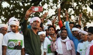 Galandar, Dungarpur, Rajasthan, India - April 25 : Kantilal Raot, the Bharatiya Tribal Party candidate from Banswara - Dungarpur lok sabha constituency, takes selfy with supporters at a public meeting n Dungarpur, Rajasthan, India on Thursday,, 25 April 2019.(Himanshu Vyas/Hindustan Times) Galandar, Dungarpur, Rajasthan, India - April 25 : Kantilal Raot, the Bharatiya Tribal Party candidate from Banswara - Dungarpur lok sabha constituency, takes selfy with supporters at a public meeting n Dungarpur, Rajasthan, India on Thursday,, 25 April 2019.(Himanshu Vyas/Hindustan Times)