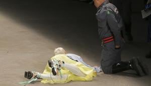 Model Tales Soares lies on the catwalk as a paramedic tends to him after he collapsed during Sao Paulo Fashion Week in Sao Paulo, Brazil, Saturday, April 27, 2019.(AP photo) Model Tales Soares lies on the catwalk as a paramedic tends to him after he collapsed during Sao Paulo Fashion Week in Sao Paulo, Brazil, Saturday, April 27, 2019.(AP photo)