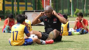 Former South African and Manchester United footballer Quinton Fortune gives tips to students from Shiv Nadar School during a training session, in Gurugram. Former South African and Manchester United footballer Quinton Fortune gives tips to students from Shiv Nadar School during a training session, in Gurugram.