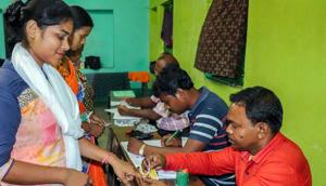 Bardhaman: A voter gets her finger marked with indelible ink before casting vote at a polling station, during the 4th phase of Lok Sabha elections, in Bardhaman, Monday, April 29, 2019. (PTI Photo)(PTI)