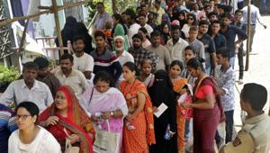 People stand outside a polling booth to cast their votes in Mumbai, India, Monday, April 29, 2019.(AP file photo)