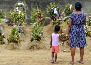 On Saturday, a gruesome scene was revealed at the raided house -- charred bodies and a roof blown off during three explosions.(AFP File) On Saturday, a gruesome scene was revealed at the raided house -- charred bodies and a roof blown off during three explosions.(AFP File)