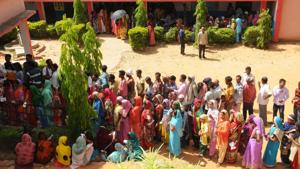 Voters queue up outside a polling booth in Mandar under Lohardaga parliamentary constituency, Jharkhand, Monday, April 29, 2019.(Diwakar Prasad/ HT Photo)