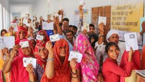 Election Results 2019: People show their voter's identity cards as they wait in queues to cast their votes at a polling station(PTI) Election Results 2019: People show their voter's identity cards as they wait in queues to cast their votes at a polling station(PTI)