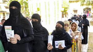 Women show their voter's identity cards as they wait in a queue to cast their votes at a polling station, during the 4th phase of Lok Sabha elections, in Etawah, Monday, April 29, 2019.(PTI)
