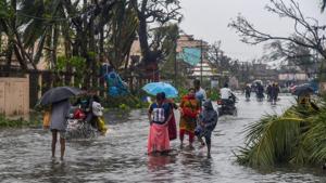 Puri: People wade through a flooded street after Cyclone Fani made its landfall, in Puri(PTI) Puri: People wade through a flooded street after Cyclone Fani made its landfall, in Puri(PTI)