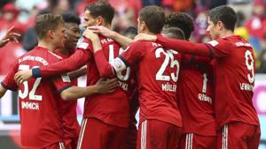 Bayern's players celebrate after scoring their side's third goal.(AP) Bayern's players celebrate after scoring their side's third goal.(AP)