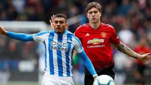 Huddersfield Town's Karlan Ahearne-Grant in action with Manchester United's Victor Lindelof.(Action Images via Reuters)
