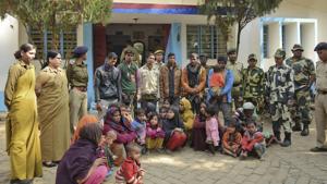 In this file photo, Tripura police officials stand next to Rohingya Muslims after they were arrested in January.(AP) In this file photo, Tripura police officials stand next to Rohingya Muslims after they were arrested in January.(AP)