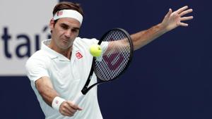 Roger Federer, of Switzerland returns to John Isner, during the singles final of the Miami Open.(AP) Roger Federer, of Switzerland returns to John Isner, during the singles final of the Miami Open.(AP)