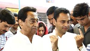 Madhya Pradesh Chief Minister Kamal Nath and his son Nakul Nath show their fingers marked with indelible ink after casting their vote at a polling booth during the 4th phase of Lok Sabha elections in Chhindwara on Monday.(ANI)