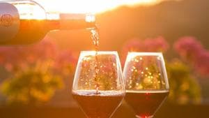 Wine being poured into two glasses at a picturesque location.(Unsplash) Wine being poured into two glasses at a picturesque location.(Unsplash)