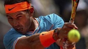 Rafael Nadal, from Spain, returns the ball to Felix Auger-Aliassime, from Canada.(AP) Rafael Nadal, from Spain, returns the ball to Felix Auger-Aliassime, from Canada.(AP)
