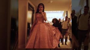 <p>Bollywood actor Deepika Padukone, who made a grand appearance at the Monday night's MET Gala in New York, tripped on her dress while she sipped on some wine in a hotel lobby. In a video, the actress is seen turning around as a few people help her with her barbie dress' train when she almost trips and immediately regains control, avoiding a fall. At the event, Deepika donned a multi-layered 3D printed gown designed by Zac Posen.</p>