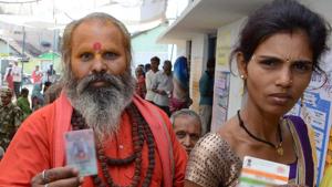Voters queue up to cast their votes at a polling station in Madhya Pradesh.(ANI Photo)