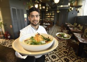 Chef Lokesh Swami holds up a plated dish of Baked Ricotta Gnocchi made from local produce at the restaurant NicoCaara in New Delhi.(Raj K Raj/HT PHOTO) Chef Lokesh Swami holds up a plated dish of Baked Ricotta Gnocchi made from local produce at the restaurant NicoCaara in New Delhi.(Raj K Raj/HT PHOTO)