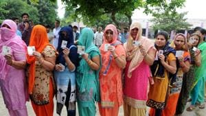 Gurgaon, India- September 24: Women stand in queue with voter card to cast their vote during the MCG election, in Gurgaon, India, on Sunday, 24 September 2017. (Photo by Parveen Kumar/Hindustan Times) Gurgaon, India- September 24: Women stand in queue with voter card to cast their vote during the MCG election, in Gurgaon, India, on Sunday, 24 September 2017. (Photo by Parveen Kumar/Hindustan Times)