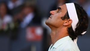Roger Federer reacts as he plays against Dominic Thiem in Madrid.(AFP) Roger Federer reacts as he plays against Dominic Thiem in Madrid.(AFP)