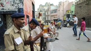 Security officers sit outside a polling station during the sixth phase of voting for national elections(Bloomberg) Security officers sit outside a polling station during the sixth phase of voting for national elections(Bloomberg)