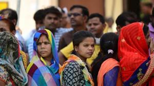Women queue up to cast their votes at a polling station in Uttar Pradesh.(AFP)