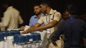 Polling officials leave with Electronic Voting Machine (EVM) and Voter Verified Paper Audit Trail (VVPATs) ahead of Lok Sabha Polls at a distribution centre in South Delhi.(ANI photo)
