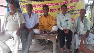 Farmers from Kushinagar sitting on dharna, demanding return of their agricultural land acquired for the Maitreya Buddha Project.(HT Photo) Farmers from Kushinagar sitting on dharna, demanding return of their agricultural land acquired for the Maitreya Buddha Project.(HT Photo)