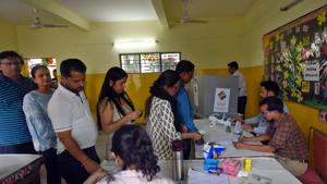 Voters at a polling station in Greater Kailash, under New Delhi parliamentary constituency, during the sixth phase of Lok Sabha elections, Sunday, May 12, 2019.(Amal KS/HT PHOTO)