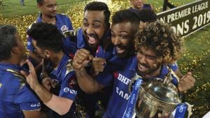 Mumbai Indians' Lasith Malinga, right, and teammates celebrate with the trophy after their win over Chennai Super Kings in the final cricket match of VIVO IPL T20 in Hyderabad, India, early Monday, May 13, 2019(AP)