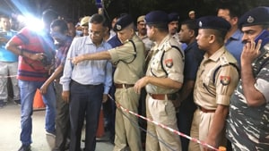 Assam’s Director General of Police Kuladhar Saikia (fourth from right) at the site of the grenade attack in Guwahati on Wednesday evening.(HT PHOTO)