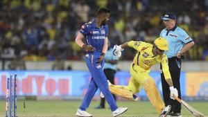 Chennai Super Kings captain Mahendra Singh Dhoni, center, runs unsuccessfully to make it to the crease.(AP) Chennai Super Kings captain Mahendra Singh Dhoni, center, runs unsuccessfully to make it to the crease.(AP)