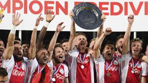 Ajax Amsterdam's captain Matthijs de Ligt holds the champions plate as he celebrates with team mates.(AFP) Ajax Amsterdam's captain Matthijs de Ligt holds the champions plate as he celebrates with team mates.(AFP)