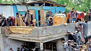 People gather at the broken house where Hizbul Mujahideen militants were killed in Panzgam area of Pulwama(ANI Photo) People gather at the broken house where Hizbul Mujahideen militants were killed in Panzgam area of Pulwama(ANI Photo)