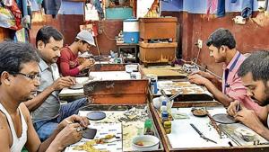 Artisans at work at a small unit that handles gold and silver ornamental work in Regar Pura in Karol Bagh, in New Delhi(Raj K Raj/ Hindustan Times) Artisans at work at a small unit that handles gold and silver ornamental work in Regar Pura in Karol Bagh, in New Delhi(Raj K Raj/ Hindustan Times)