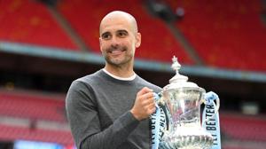 Manchester City's Spanish manager Pep Guardiola holds the FA Cup trophy.(AFP) Manchester City's Spanish manager Pep Guardiola holds the FA Cup trophy.(AFP)
