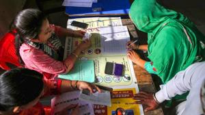 A voter signs a document after casting her vote at a polling station during the seventh and last phase of Lok Sabha elections, at village Bhoot, near Amritsar, Sunday, May 19, 2019.(PTI photo)