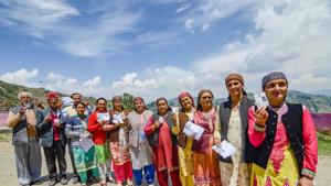 Shimla: Voters display their polling identity cards after casting their votes during the seventh and last phase of Lok Sabha elections, at Theon village near Shimla.(PTI)